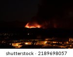 Small photo of Borja, Spain - Aug 13, 2022: View of forest fire flames in the Moncayo, devouring hills and trees with virulence, thanks to hurricane force winds and drought
