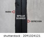 Black and white wall with text BIPOLAR DISORDER , left side MANIA, right side DEPRESSION - concept of mental health extreme mood swings include emotional highs (mania) and lows (depression)