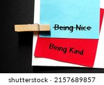 Small photo of Blue and red paper with handwriting BEING NICE, changed to BEING KIND, to stop being People Pleaser, prioritize self-respect and stop seeking validation with niceness