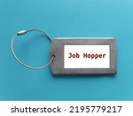 Small photo of ID holder with title JOB HOPPER, means person who works briefly in one position after another rather than staying long term in organization