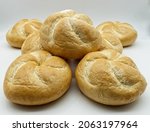 Fresh Kaiser rolls baked bread. Kaiser is a type of round, hard, and crunchy bread originally from Austria, often used to make sandwiches. 