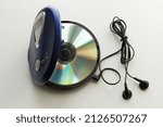 Small photo of Vintage CD Player with headphones on white background. Vintage Technology from the 90s.