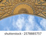 Iwan of Agha Bozorg Mosque against the sky. Patterns are made in traditional Persian style. Mosque was built in the late 18th century. Shot in Kashan, Iran.