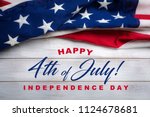 United states flag on white, weathered clapboard background with july 4th greeting