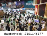 Small photo of Dubai, UAE - May 9-12, 2022: Business people visiting Dubai tourism exhibitor pavilion at 'Arabian Travel Market 2022' tradeshow. Tripadvisor rates Dubai 'the most popular destination in the world'.