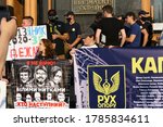 Small photo of Kyiv/Ukraine - 07.27.2020: crowd of protesting Ukrainian patriotic youth with big anti government banners near President office during protest action "movement against capitulation". Reportage photo