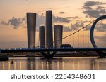 Small photo of Doha, Qatar - January 26, 2023: The golden hour beautify of Lusail Bridge with selective focus.