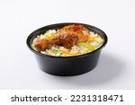 Small photo of Schezwan Chicken Fried Rice in white bowl isolated on white background. Szechuan Rice is indo-chinese cuisine dish with bell peppers, green beans, carrot, chicken breasts. Top view,side vied.