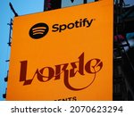 Small photo of New York City, New York United States - August 29 2021: Spotify Lorde popstar yellow billboard advertisement in Times Square with logo.