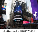 Small photo of New York City, New York United States - August 29 2021: NASDAQ, National Association of Securities Dealers Automated Quotations corporate and Lady Gaga logo sign near Times Square.