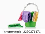 Small photo of Household Cleaner tools and sundry items Spring cleaning kitchen, bathroom and other rooms. on white. Cleaning and janitorial service concept. Green and vibrant violet. Bucket with gloves and dusters