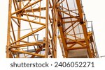 Small photo of Crane tower leg slewing support system close-up, Concept of housing construction and construction industry.