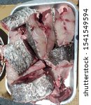 Small photo of Slices of fresh raw fish Corvina (croaker, meager, meagre, jewfish) ready to cook . Morocco .