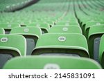 Error 404: seat not found. Rows of green seats with numbers in a stadium