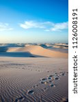 Small photo of Lencois Maranhenses National Park, Barreirinhas, Brazil, low, flat, flooded land, overlaid with large, discrete sand dunes with blue and green lagoons