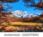 Small photo of Beautiful scenery view of Mount Fitz Roy with golden yellow fields, surrounded by trees changing colors in autumn time near El Chalten, Patagonia in Argentina.