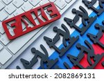 Small photo of Fake news and troll factory. Figures at the computer on the Russian flag.