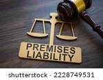 Plate with inscription Premises liability and gavel.