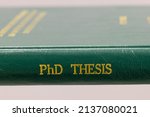 Small photo of a PhD thesis of green cover