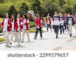 Small photo of 7 4 2023 happy young male and female high or middle school student in uniform marching for a major events in Shaoshan, Hunan, China