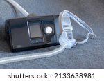 Small photo of CPAP mask with a full face mask cpap machine against obstructive sleep apnea helps patients as respirator mask and headgear clip for breathing medication in snoring sleep disorder to breath easier