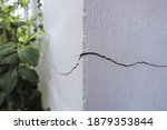 Small photo of Cracked concrete building broken wall at the outside cement corner that effected with earthquake and collapsed ground