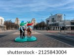 Small photo of berlin, 2022, february, 13, kitschy plastic figures stand on the median of Karl-Marx-Allee