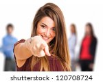 Portrait of a woman pointing her finger to you