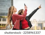 Friends using their smartphone to shoot an interesting place
