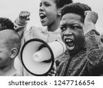 Young boy shouting on a megaphone in a protest