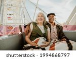 Cheerful senior couple enjoying a Ferris wheel by the Santa Monica pier