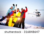 Snowboarders on Top of the Mountain with Heli Ski Concept