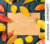 Small photo of Autum Sale. Discount banner or flyer design template with vibrant autumn leaves on a brown kraft card, with a place for text