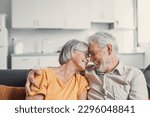 Small photo of Happy laughing older married couple talking, laughing, standing in home interior together, hugging with love, enjoying close relationships, trust, support, care, feeling joy, tenderness