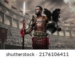 Portrait of victorious gladiator of african ethnic holding plumed helmet and spear in coliseum.