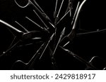 Small photo of Manicure set of tools made of steel isolated on black background, scissors and nail nippers