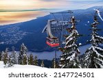 Lift gondola cabin over Vancouver panama and Capilano lake from Grouse Grind in Canada at winter