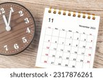 November 2023 Monthly desk calendar for 2023 year with clock.