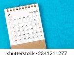 September 2023 Monthly desk calendar for 2023 year on blue background.