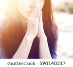 Woman Praying In Meadow At...