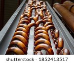 Vertical shot of copper plain tubes of a condenser coil.