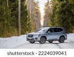 Small photo of Kostroma, Russia - November 8, 2022: A silver Subaru Forester stands on the road in a snowy winter forest