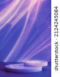 Small photo of Abstract minimal scene - empty stage, circle podiums on dark blue background with neon disco light caustic effect. Pedestal for cosmetic, product, packaging mockups presentation