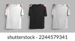 Small photo of Mockup of white, black, heather t-shirts, holding hands on the shoulders of oversized clothes, place for design, pattern, branding. Set of fashion modern unisex apparel, isolated on background, front