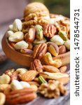 Mix Nuts In Wooden Plate On...