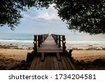 Small photo of Wooden pier on the sand beach at NusaBay Menjangan by WHM in Bali