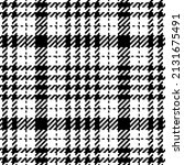Abstract check plaid pattern tweed in black and white. Seamless classic elegant neutral tartan vector for spring summer autumn winter scarf, dress, jacket, skirt, other modern fashion textile print.