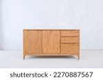 large bedside table with two doors and three drawers made of teak wood for home decoration