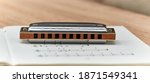 Small photo of Harmonica Blues - blues diatonic harp for playing country and Western.On light background.