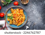 Small photo of Homemade Cabbage rolls with meat, rice and vegetables. Stuffed cabbage leaves also known as sarma, golubtsy, dolma on Dark Rustic Background